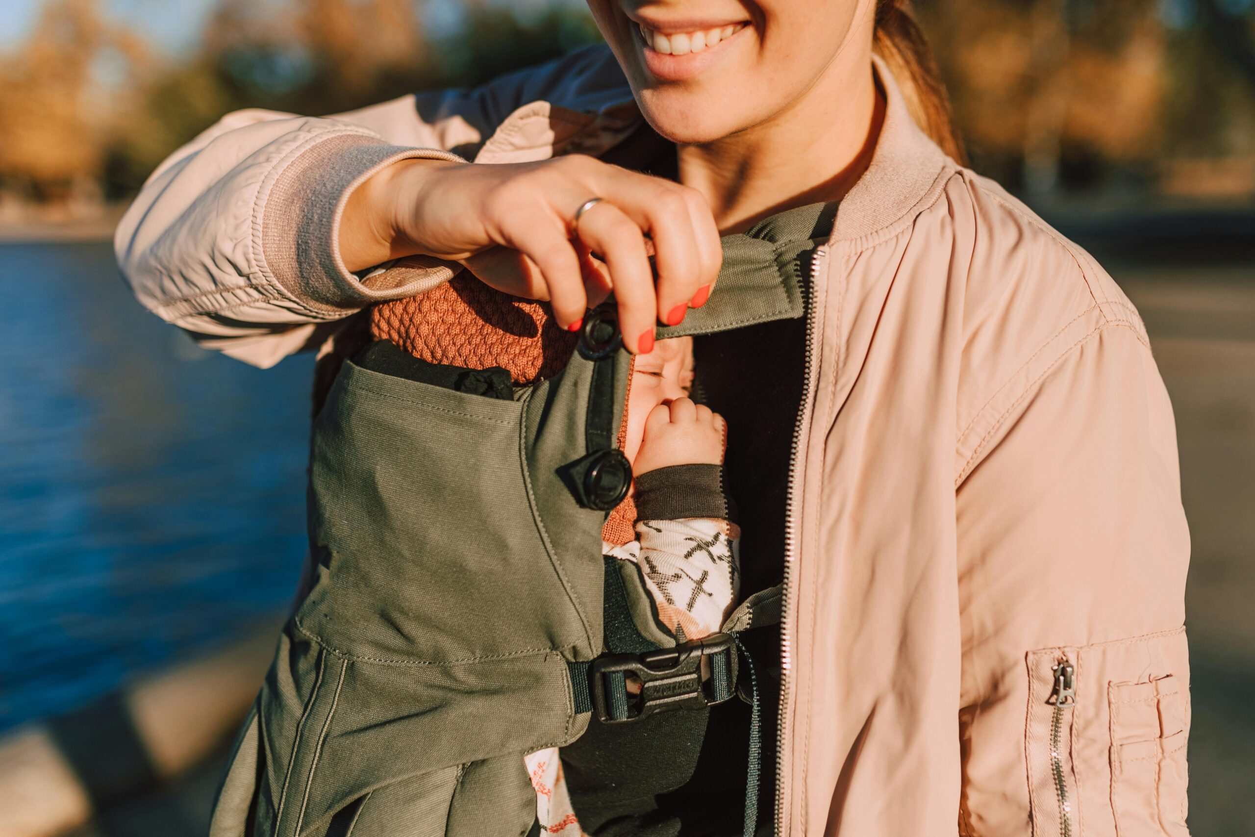 Parent carrying a baby in a front carrier
